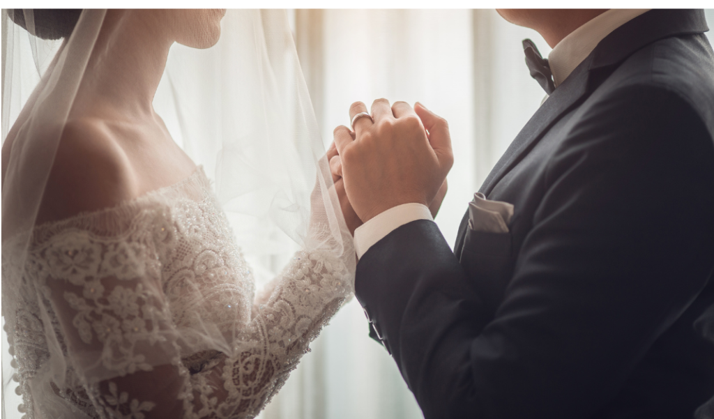 wedding couple holding hands joining on money