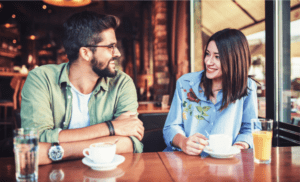 couple talking about money at a coffee shot