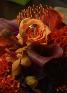 wedding rings in flowers photography