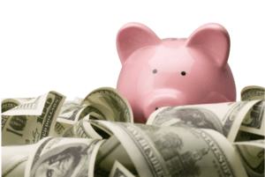 piggy bank swimming in money deciding on sinking funds for the New Year