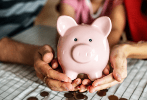 piggy bank filled with lesson learned from paying off debt 