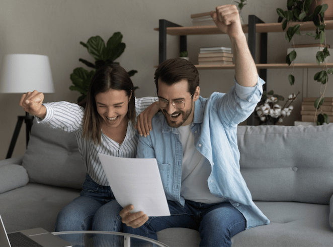 couple happy they are paying off debt