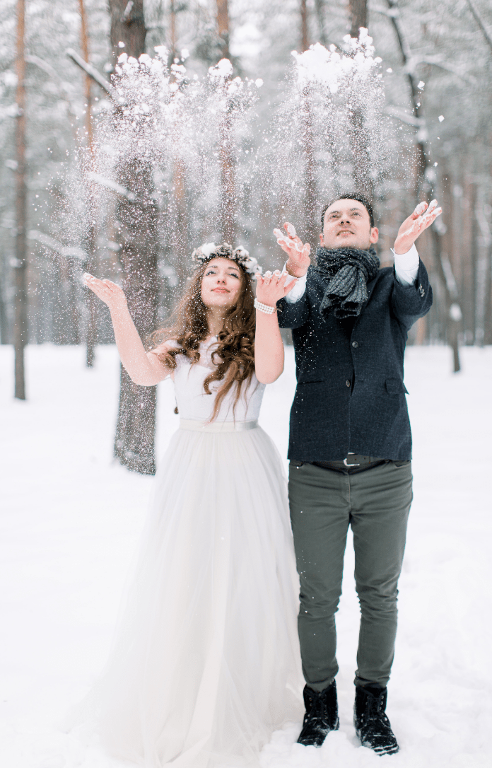 bride and groom in the snow 