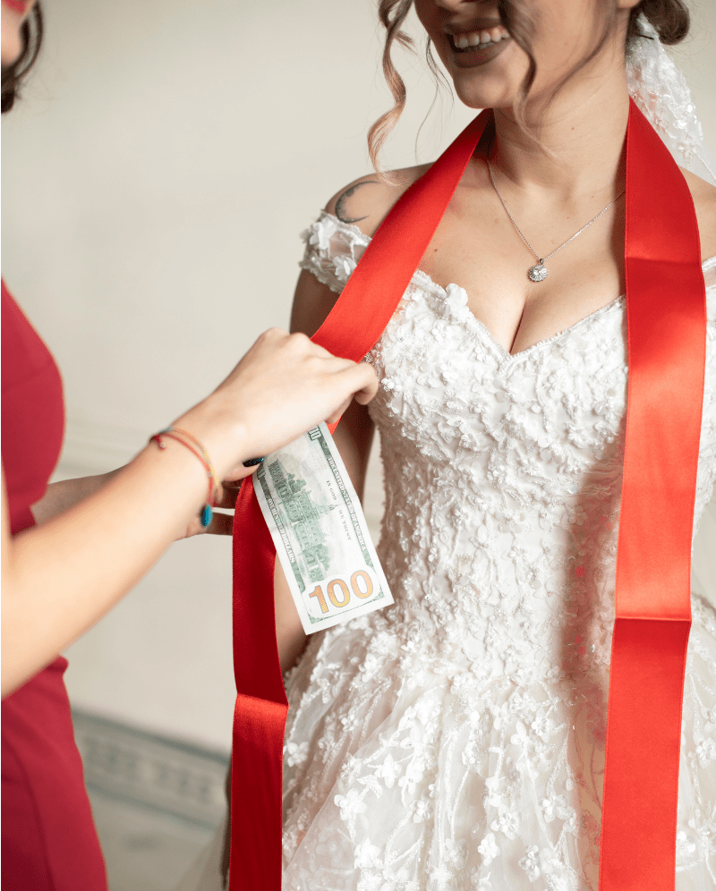 bride with ribbon and money