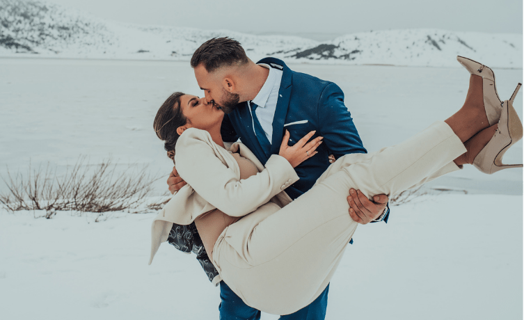 winter wedding bride and groom kissing 